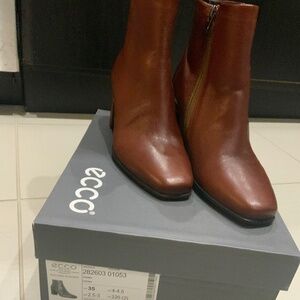 Brown leather ankle boots.  Block heel.  Zip closure.  Excellent condition.